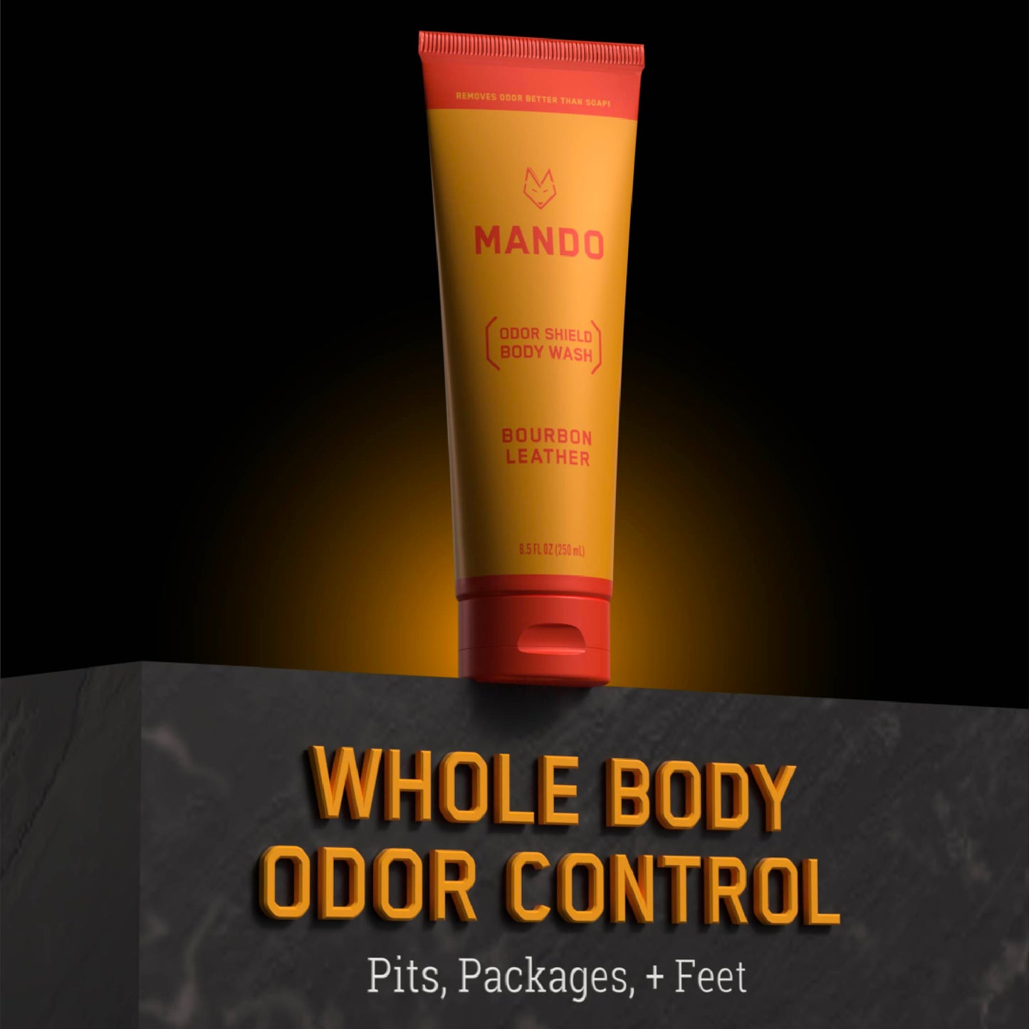 yellow orange tube of Mando body wash in bourbon leather scent with text: whole body odor control, pits, packages + feet