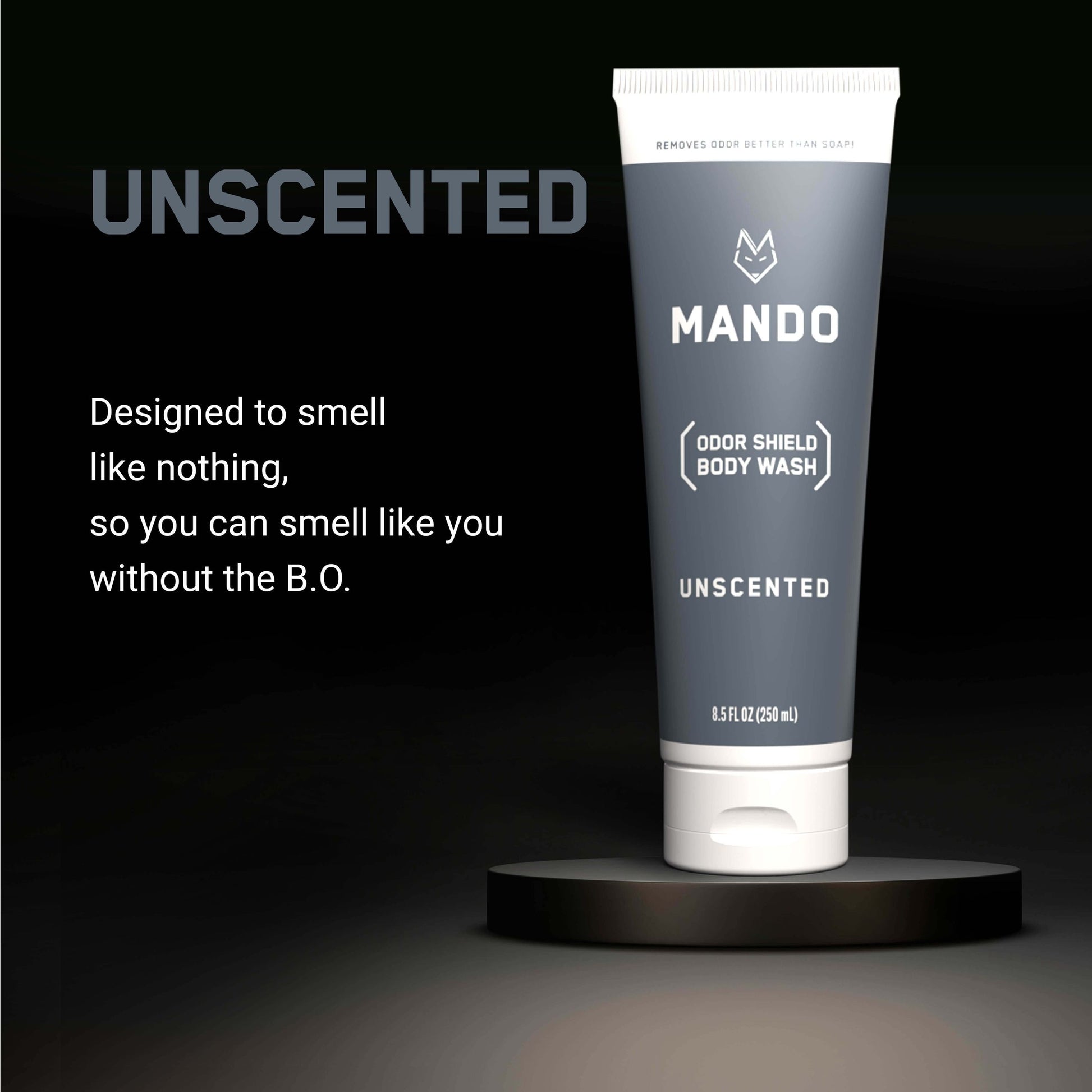grey tube of Mando body wash in unscented scent with text: designed to smell like nothing, so you can smell like you without the B.O