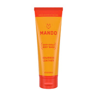 yellow orange tube of Mando body wash in bourbon leather scent on white background 
