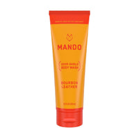 yellow orange tube of Mando body wash in bourbon leather scent on white background 