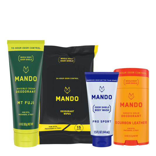 Starter pack of yellow orange Mando smooth solid deodorant stick, yellow black wipes, blue body wash and yellow green invisible cream deodorant