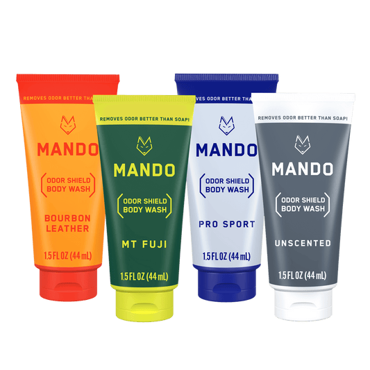 Mando mini body washes in bourbon leather, mt fuji, pro sport and unscented scents placed side by side on transparent background 