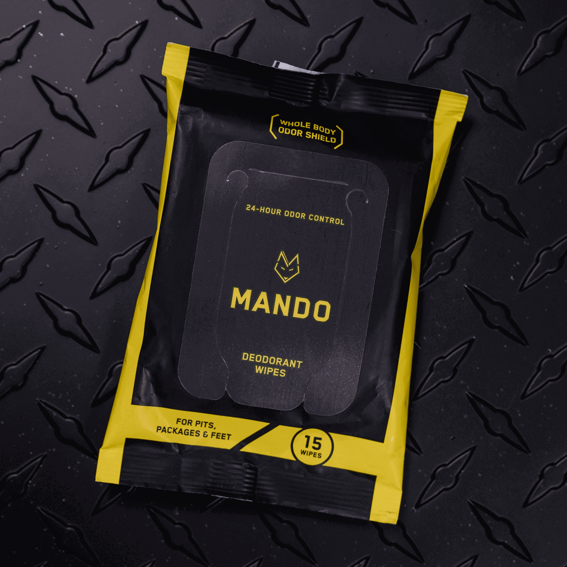 yellow and black colored pack of Mando 15 count deodorant wipes against black background
